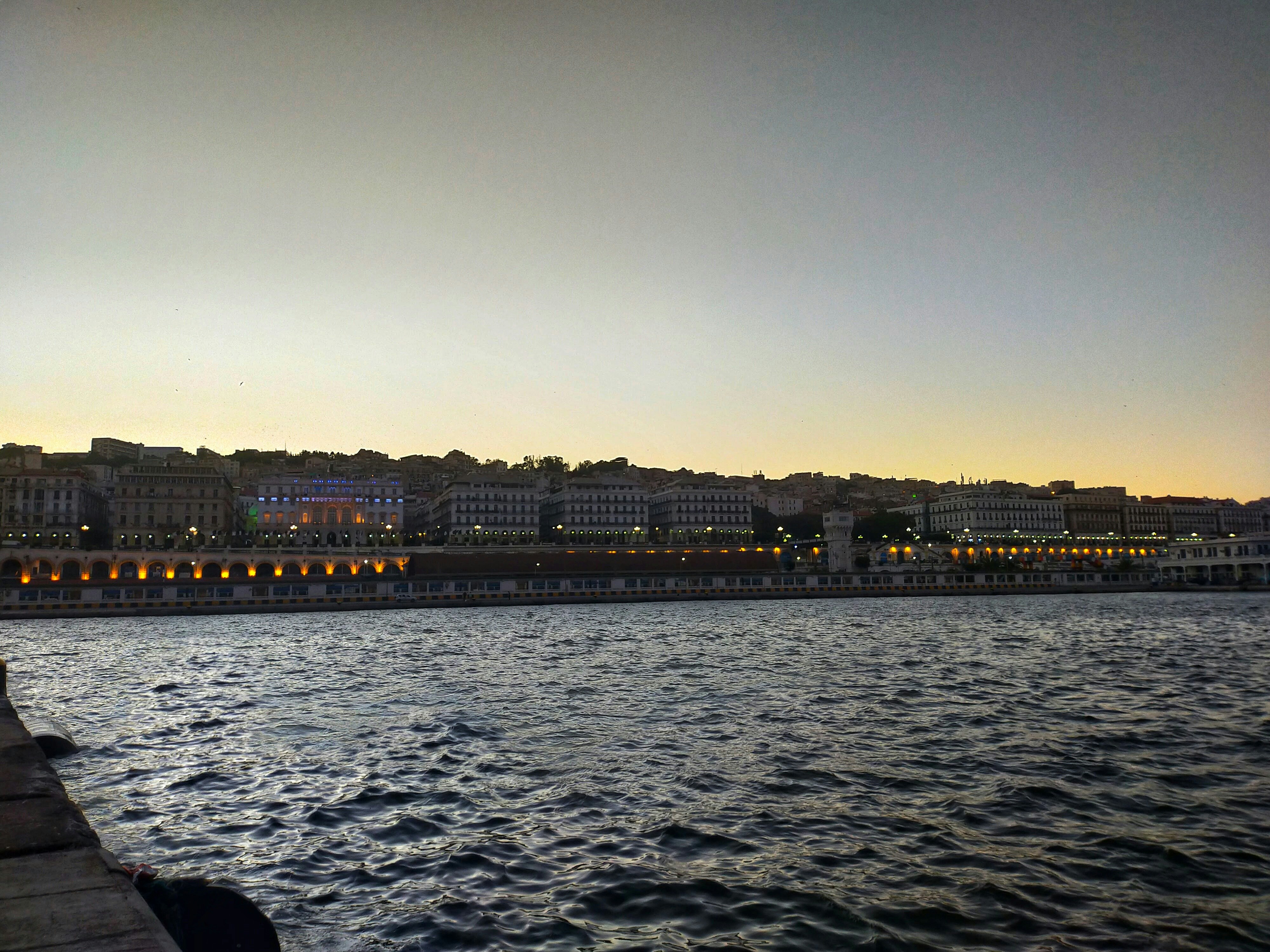 a body of water with buildings along it