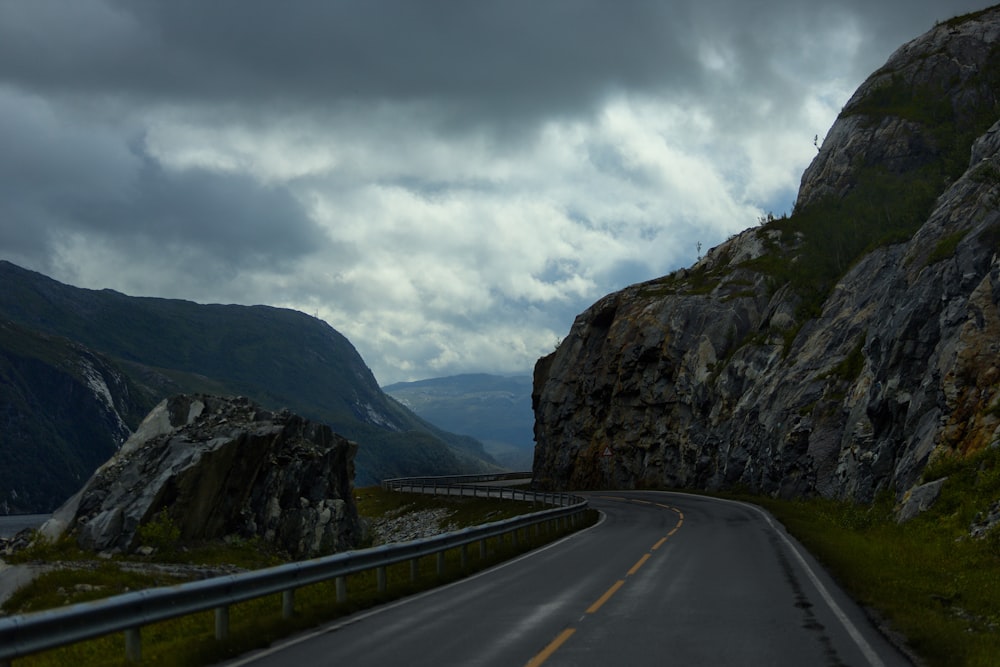 a road with mountains on either side