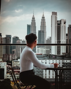 A thoughtful journalist analyzing global political landscapes with a backdrop of a city skyline.