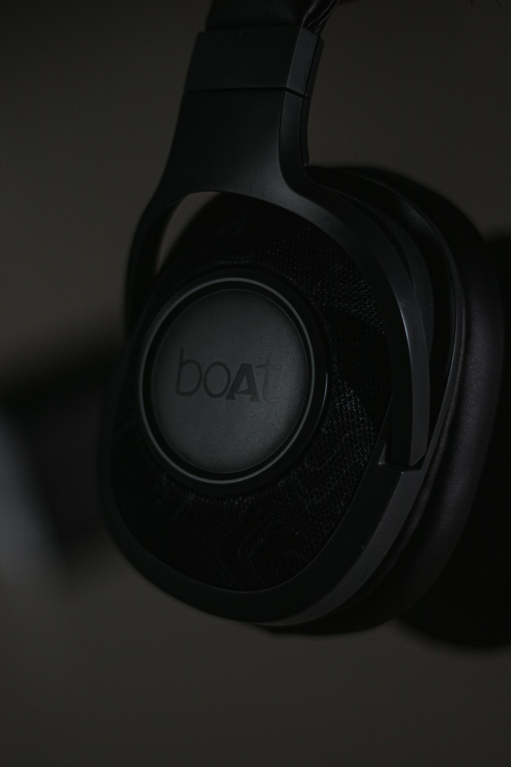 a black headphones with a black background