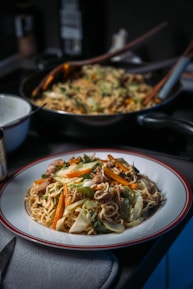 a bowl of noodles and vegetables