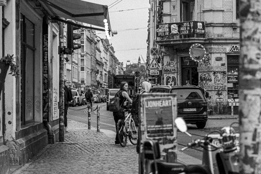 a person riding a bicycle down a city street