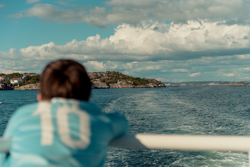 a person on a boat looking out at the ocean