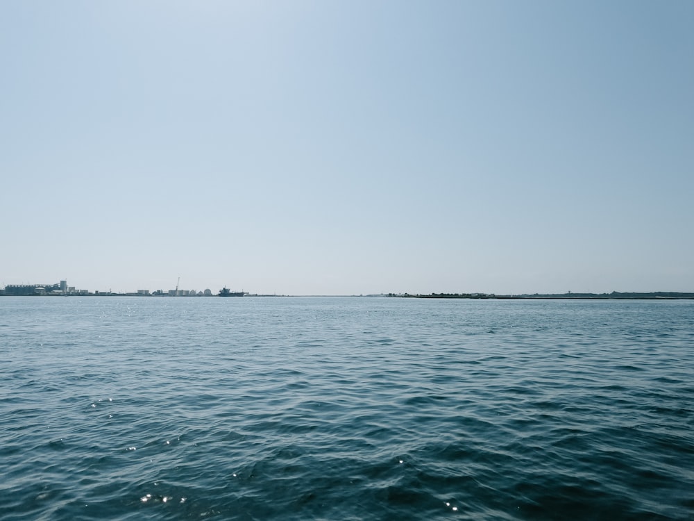 a body of water with land in the distance