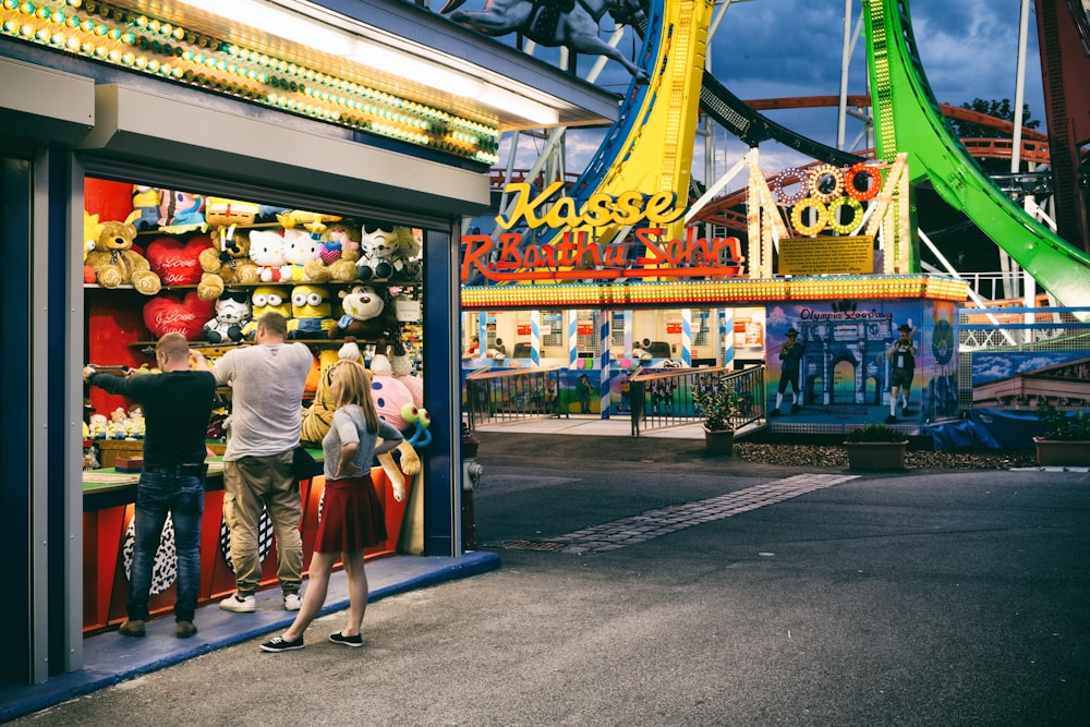 people walking in front of a colorful building