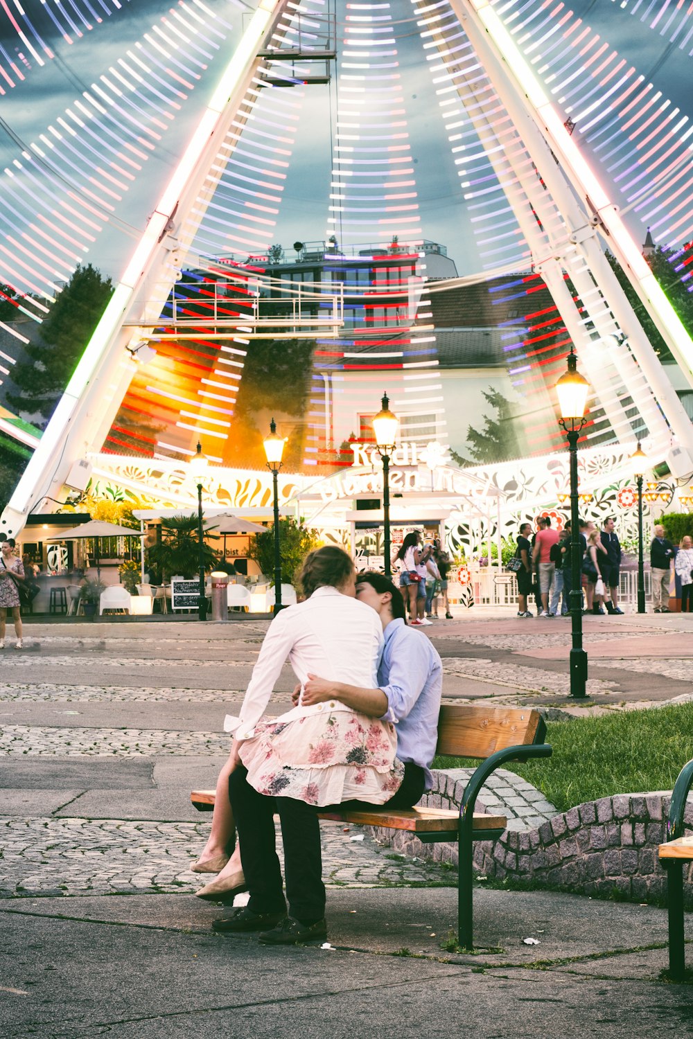 a couple sitting on a bench