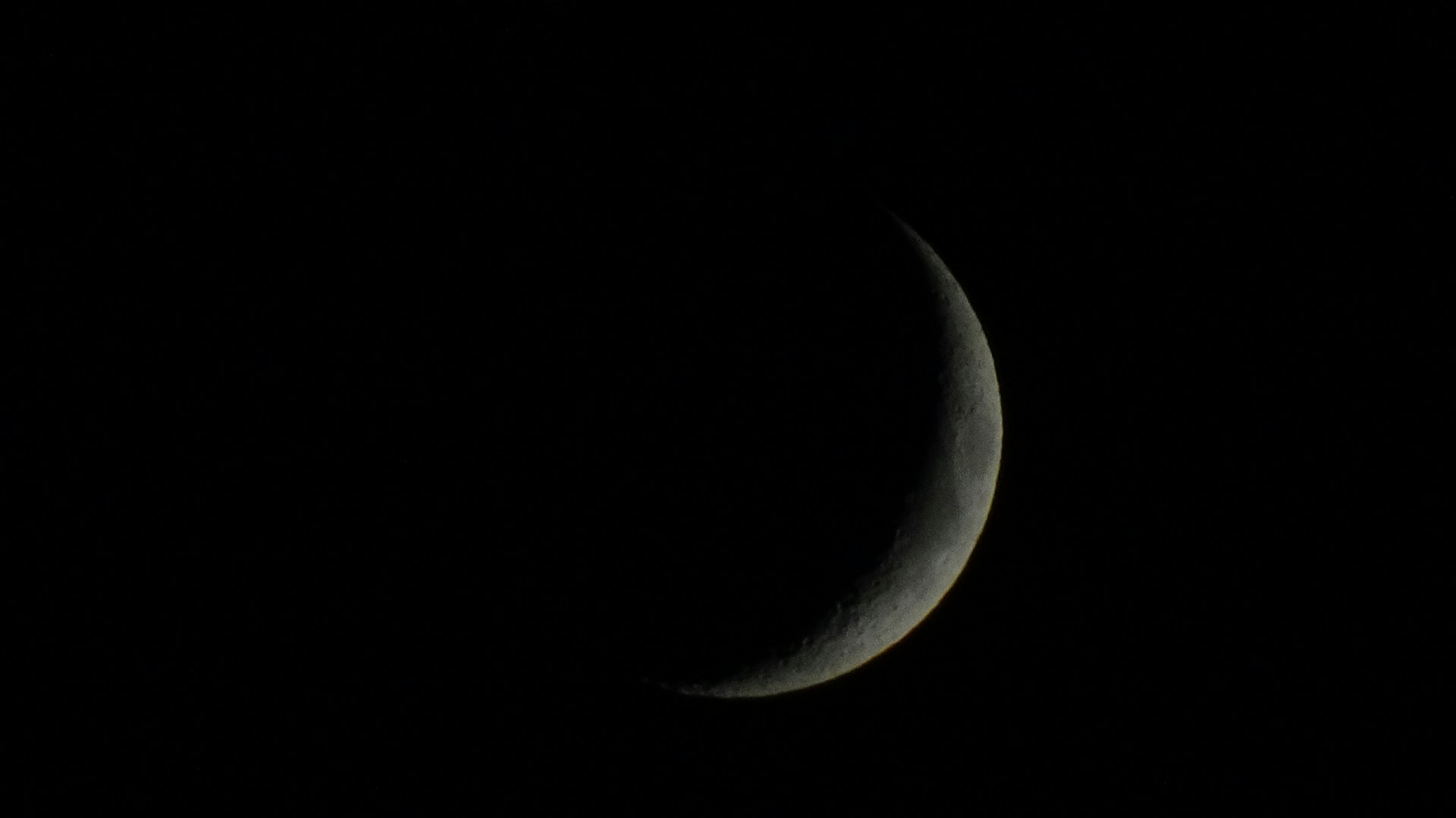 a crescent moon in the sky
