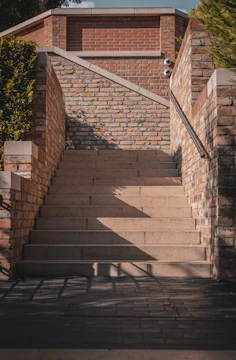 a set of stairs leading up to a brick building
