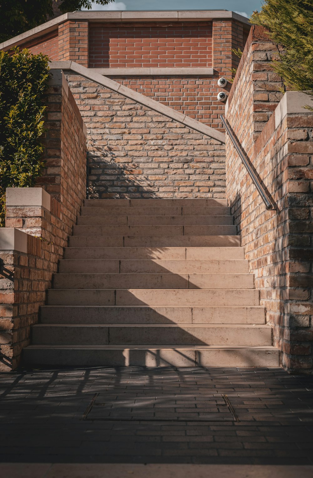 a set of stairs leading up to a brick building