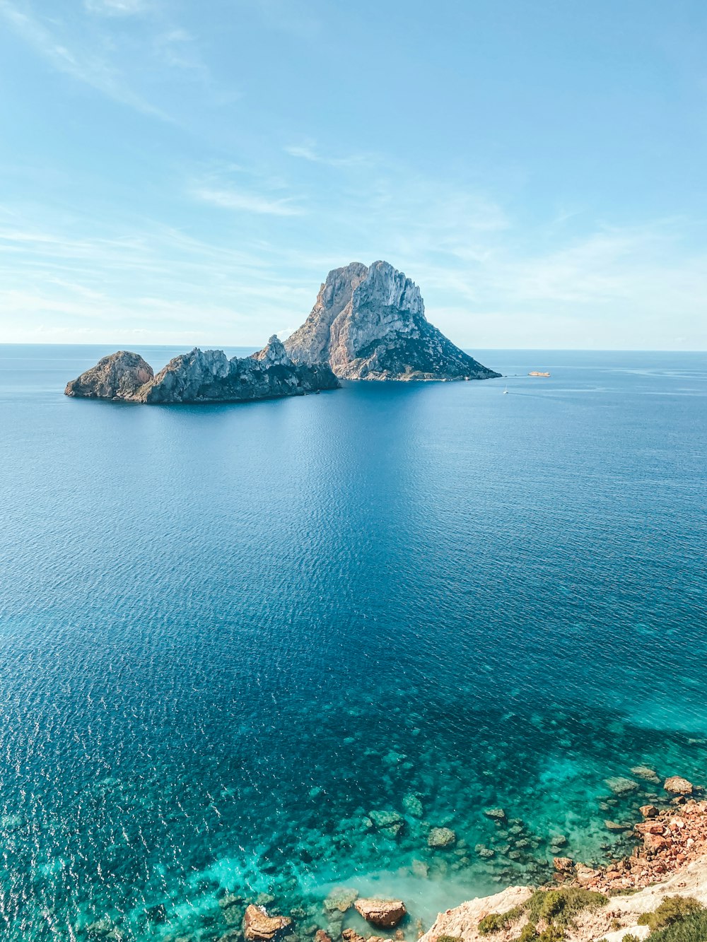 a rocky island in the ocean