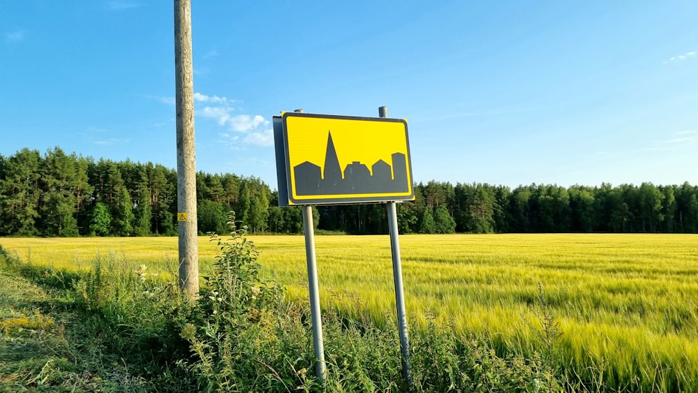 a yellow sign in a field
