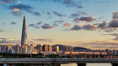 a city skyline with a bridge