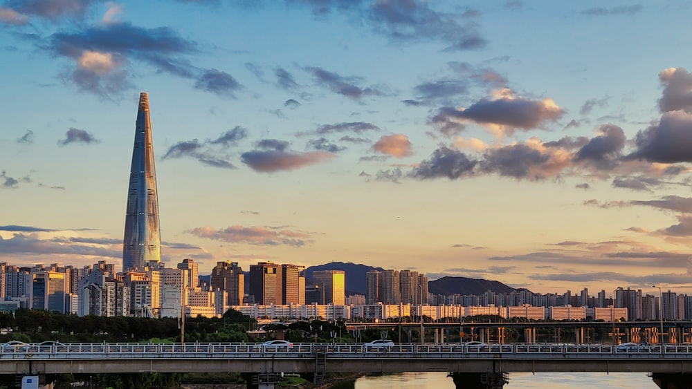 a city skyline with a bridge