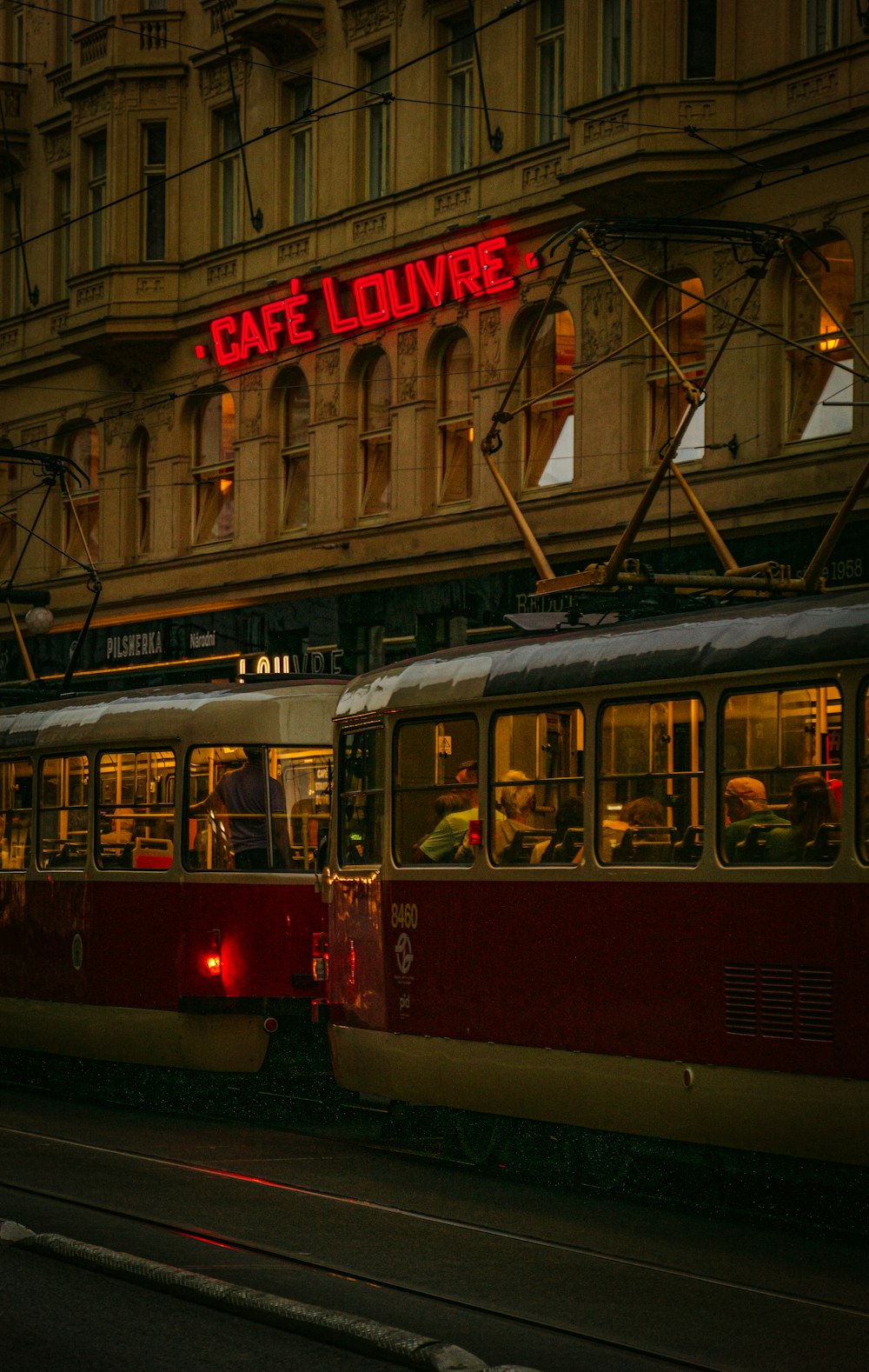 a couple of trolleys on a street