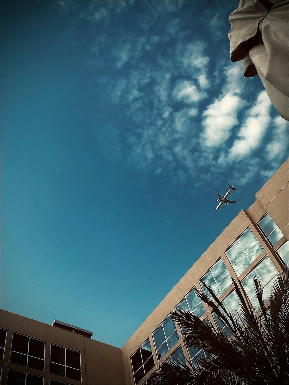 a plane flying over a building