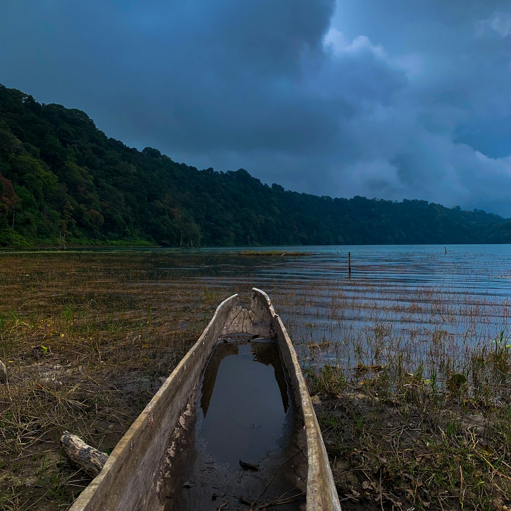 a wooden boat on a lake