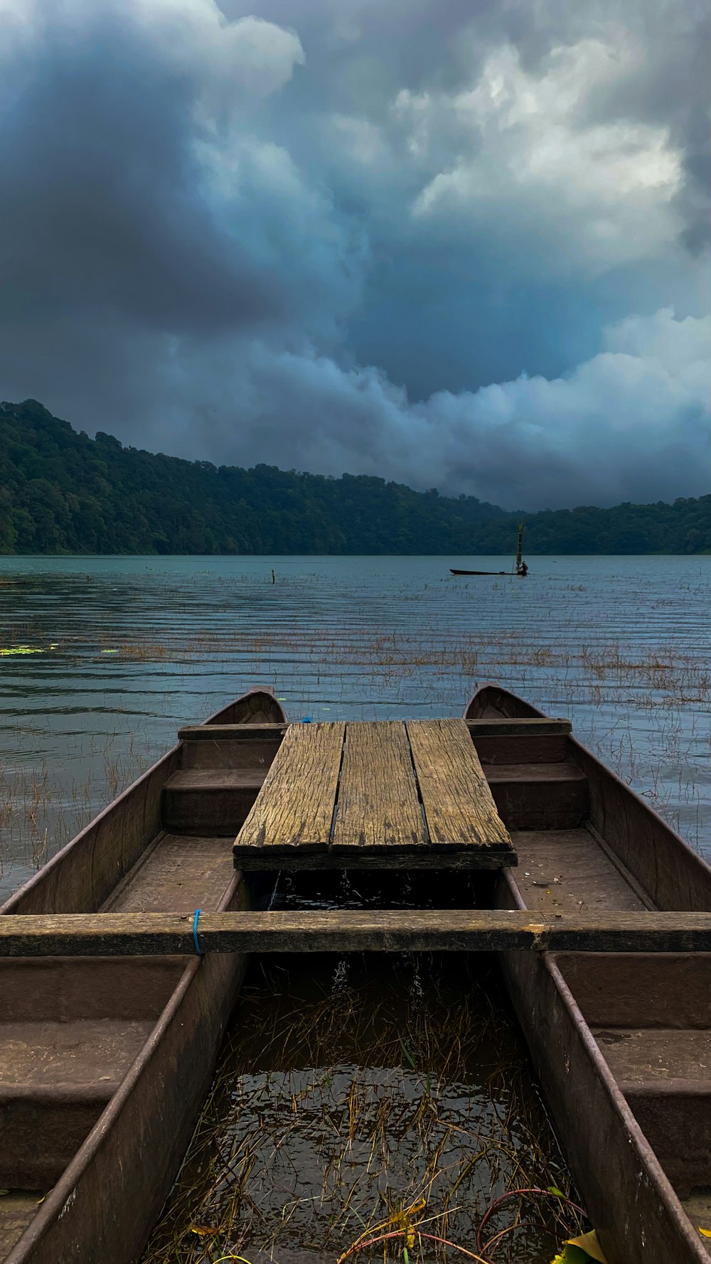 a dock with a boat in the water