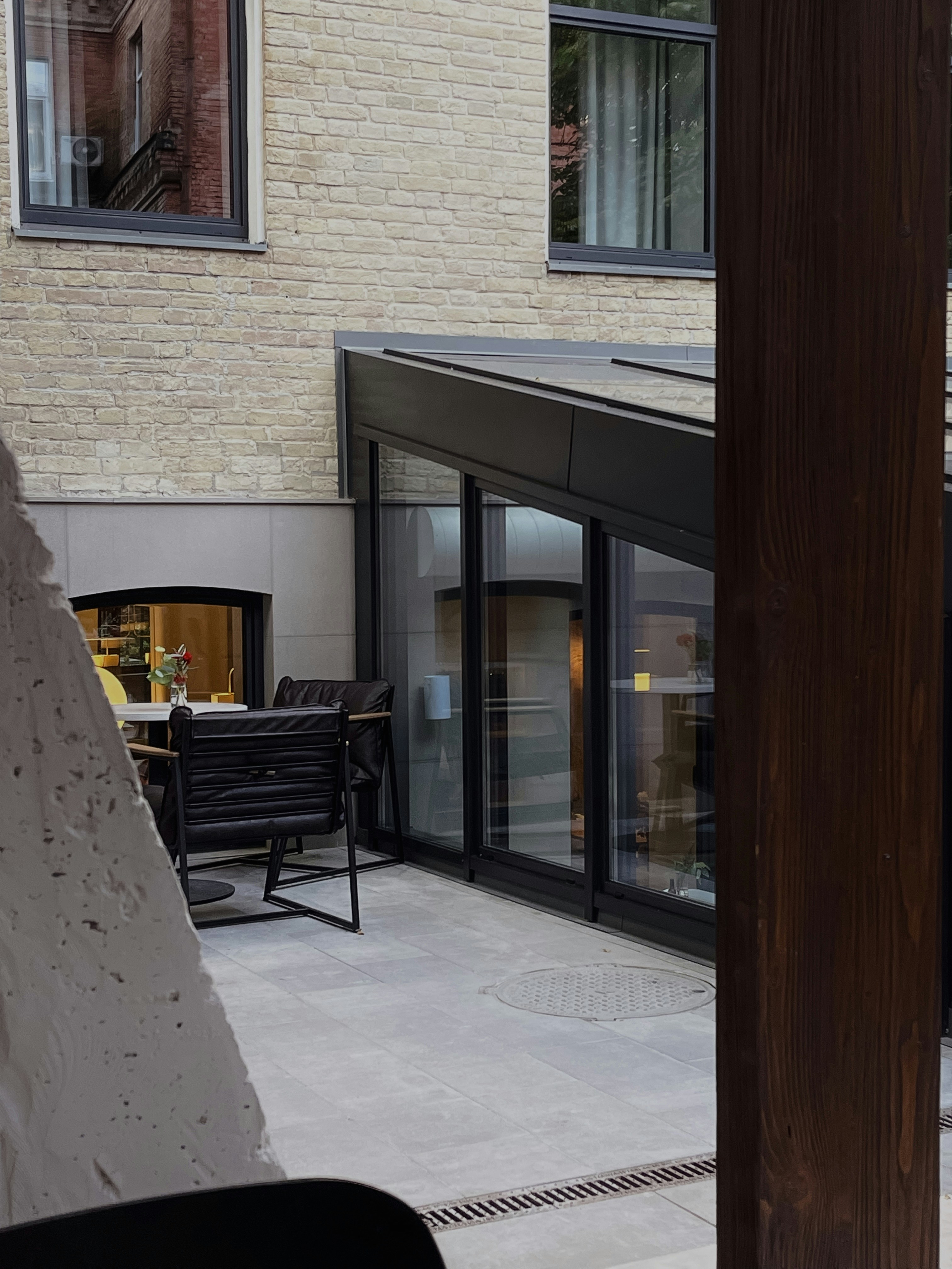 a patio with a table and chairs