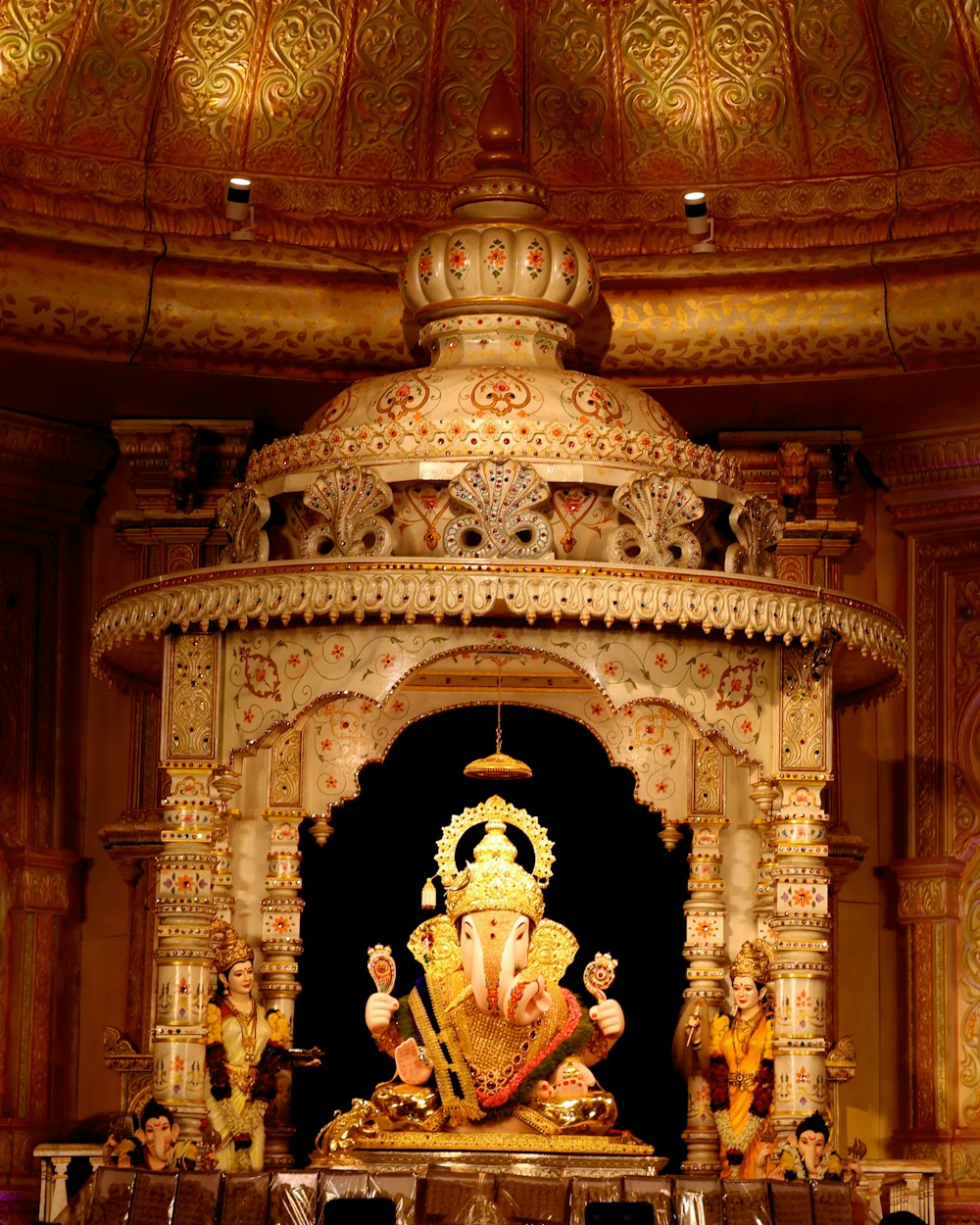 a gold statue in a room