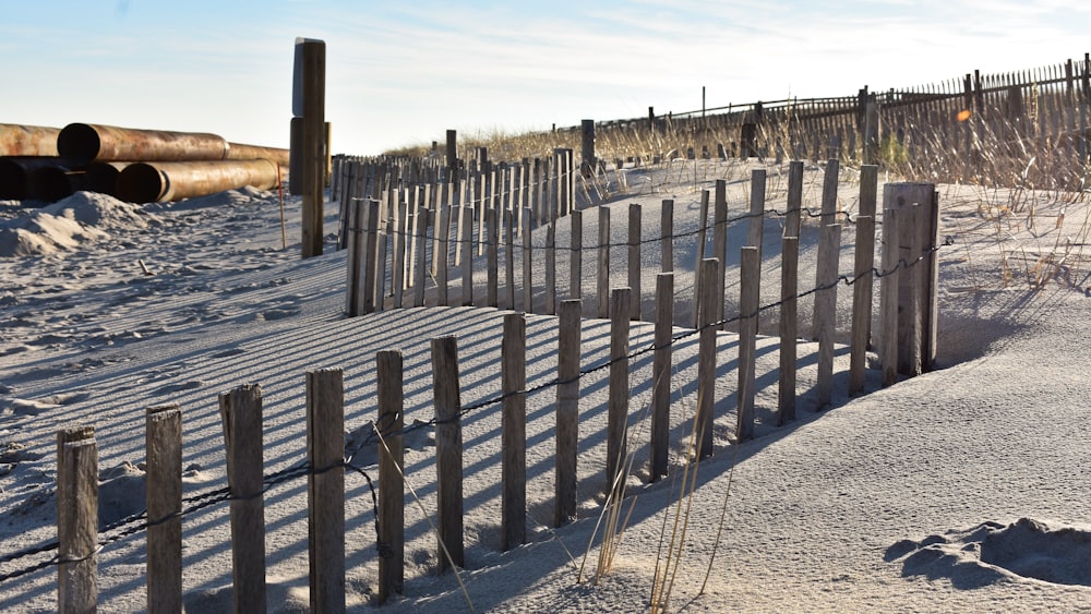 a fence in the snow