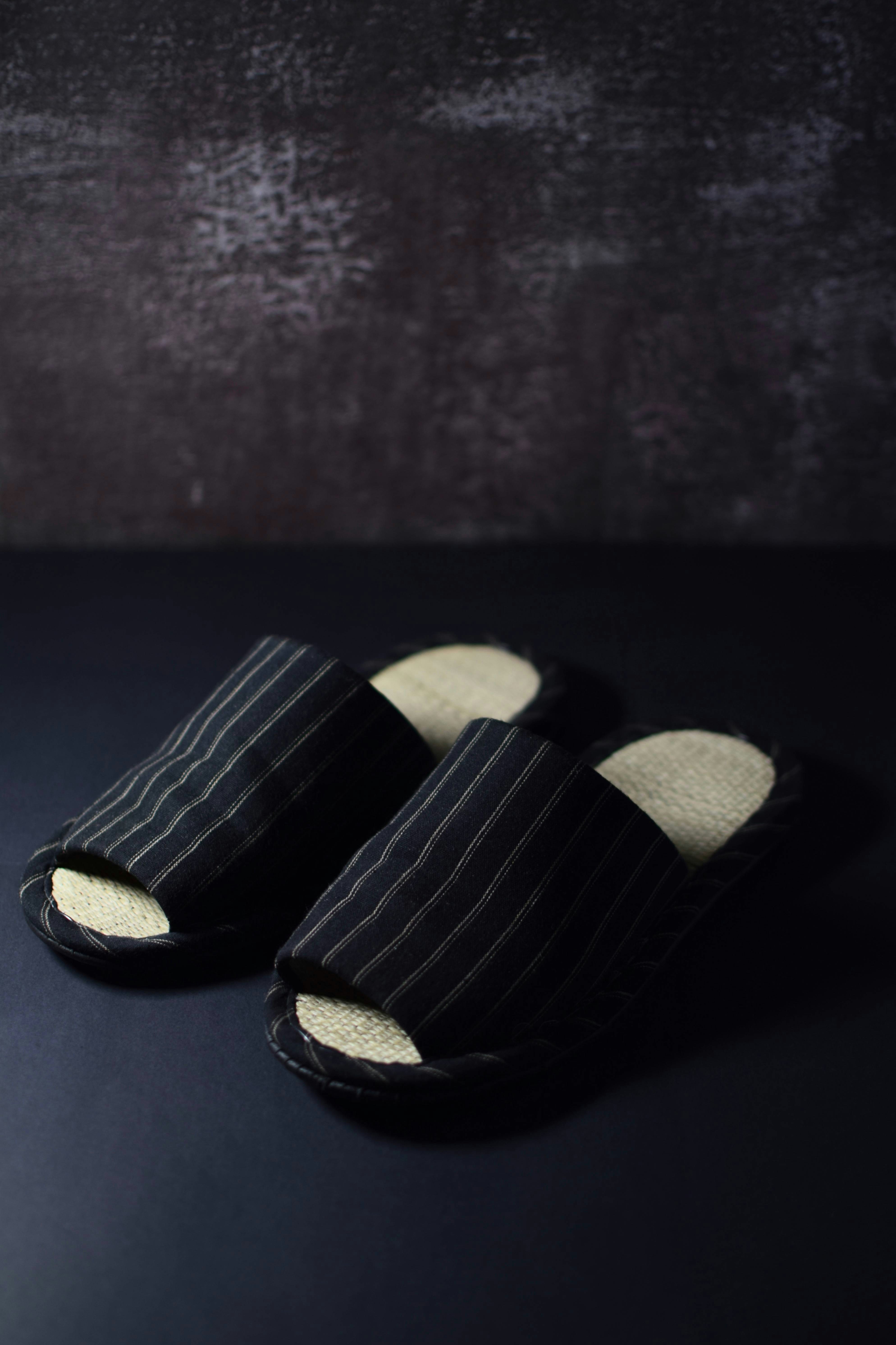 a pair of black and white striped shoes
