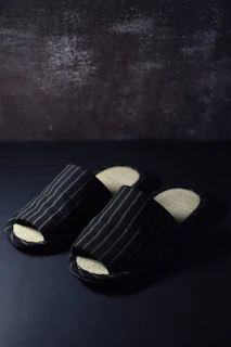 a pair of black and white striped shoes