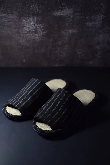 a pair of black and white striped shoes