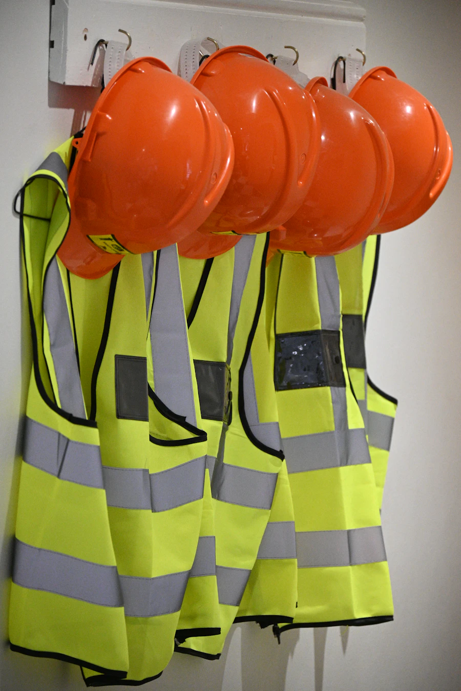 Mechanic wearing branded industrial coveralls in an automotive workshop