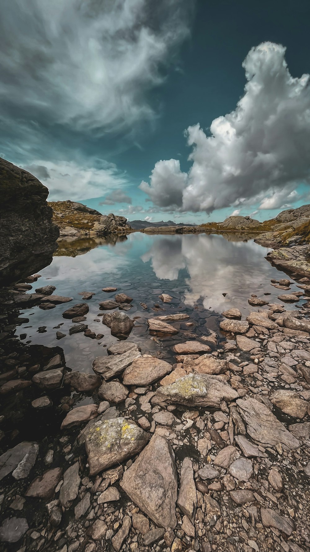 a rocky beach with a large explosion