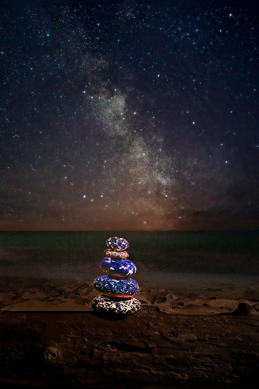 a glass ball on a beach