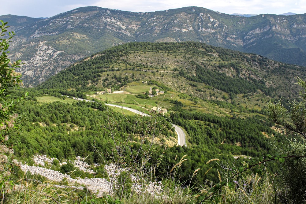 a winding road through a valley