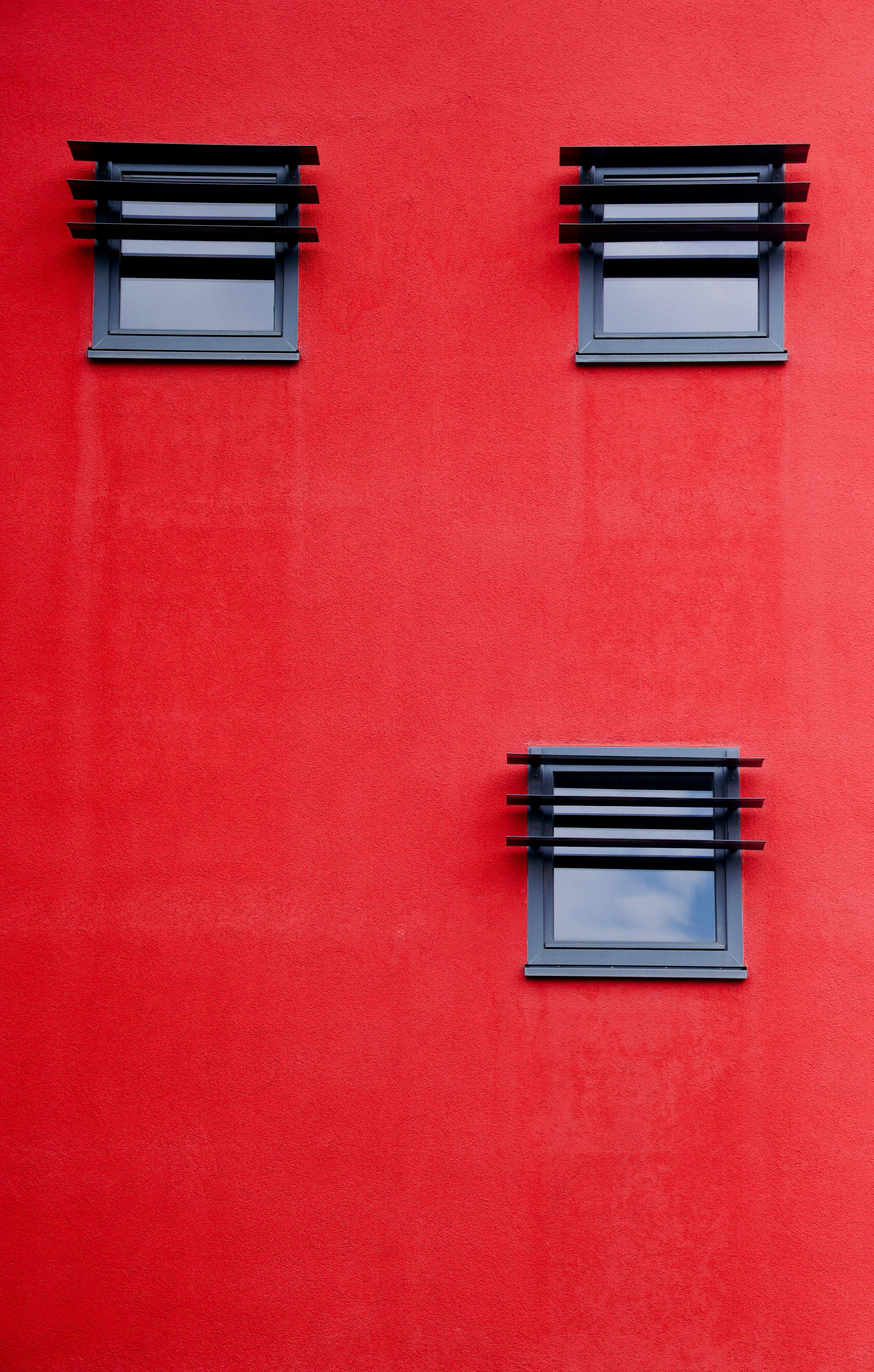 a red wall with windows