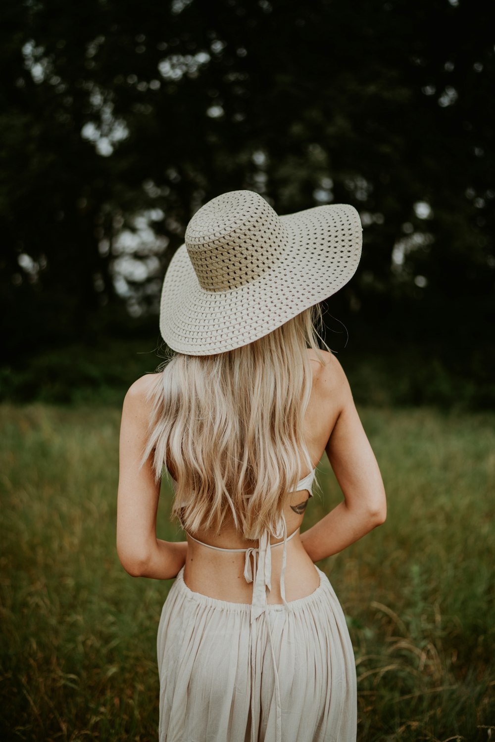 a little girl wearing a hat