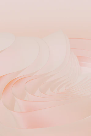 A soft pastel pink abstract wallpaper with gentle curves and subtle texture.
