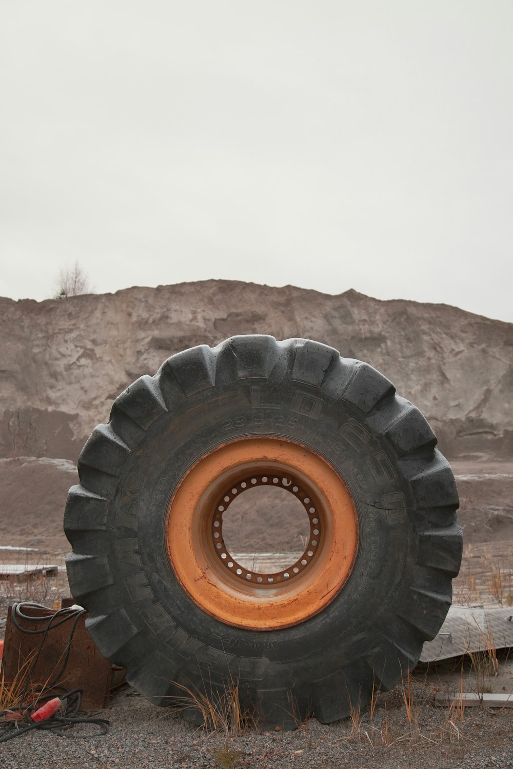 a large tire on a hill
