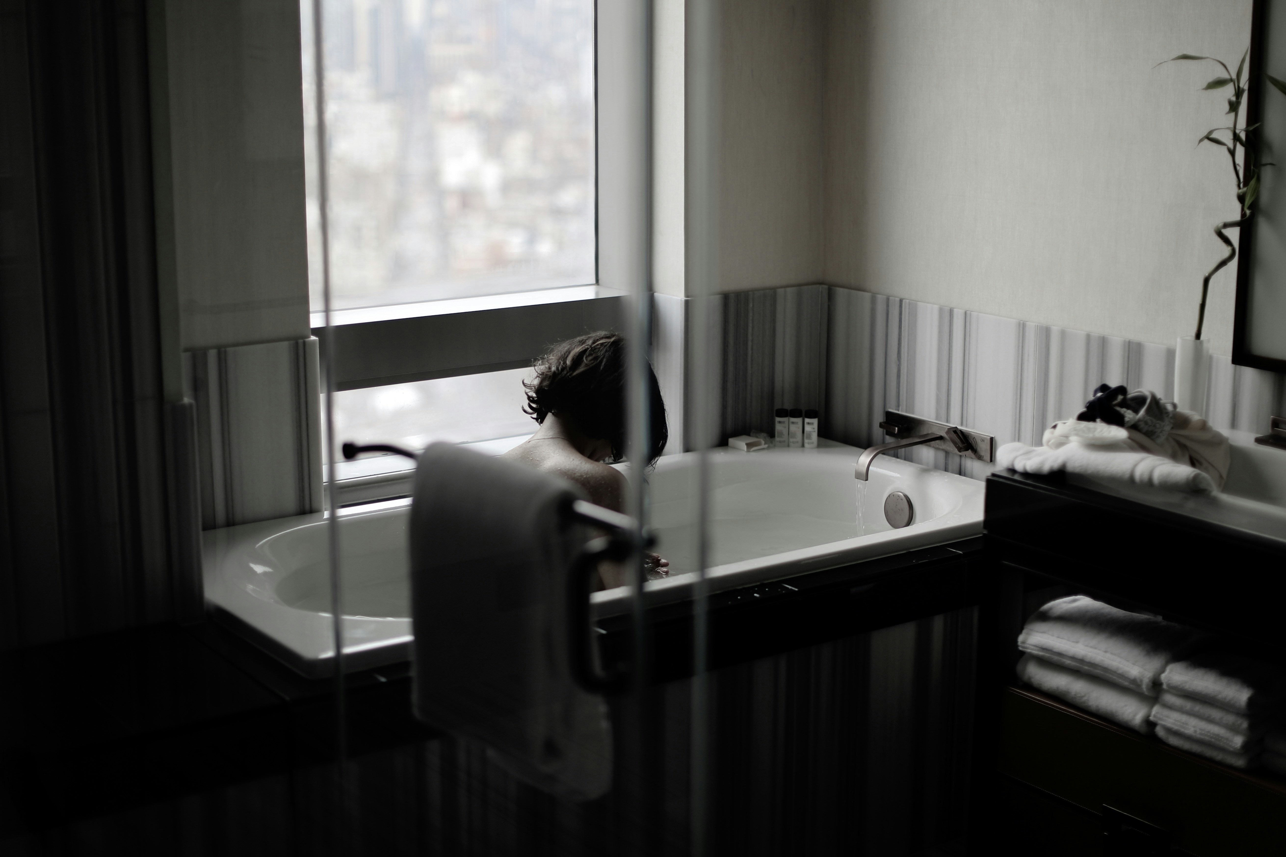 a person in a bathtub in a bathroom