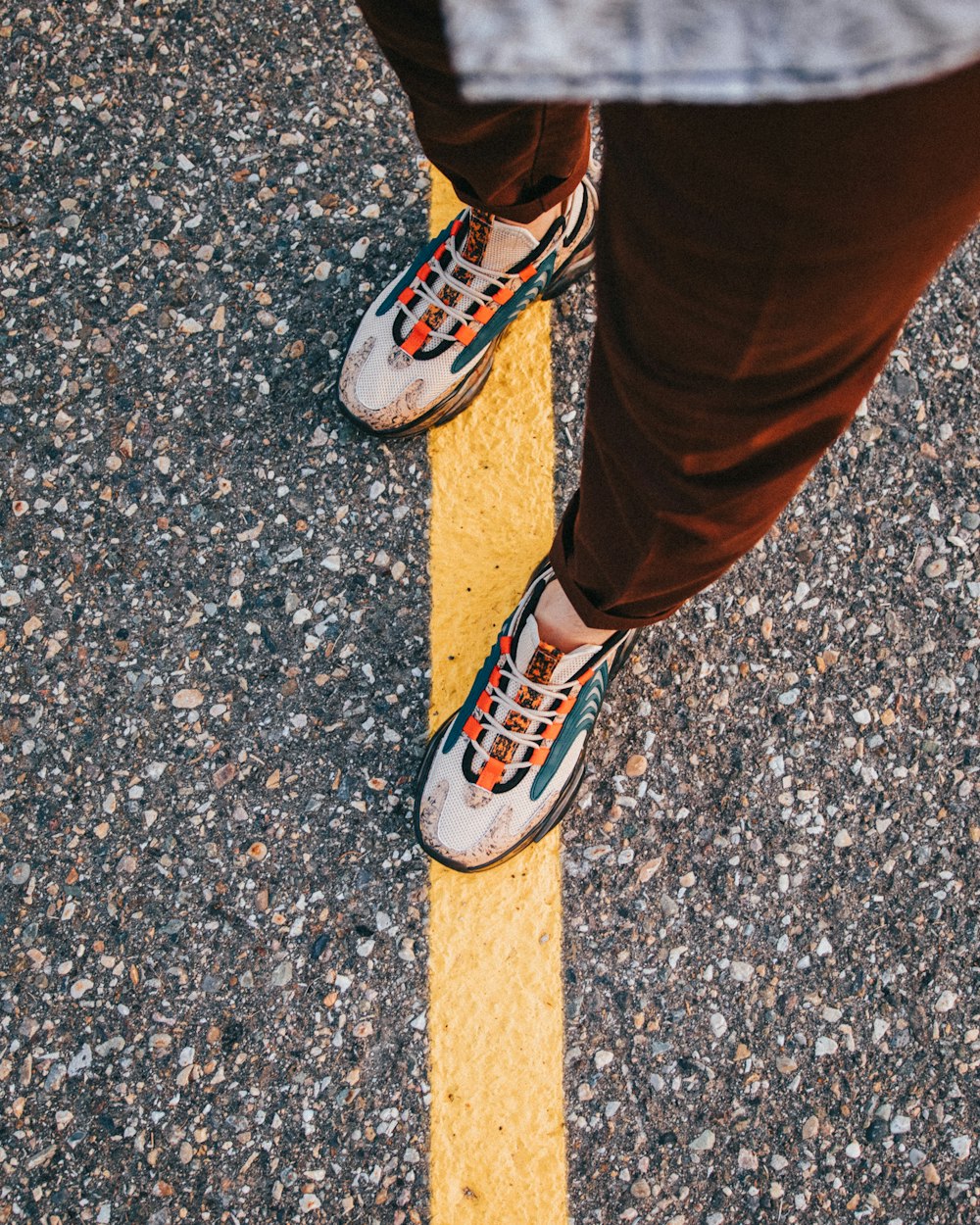 a person's feet on a wooden post