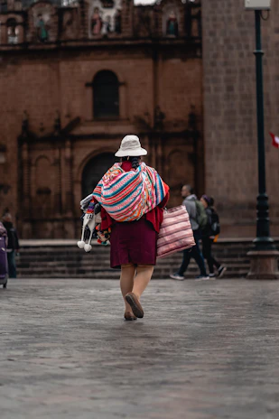 a person in a garment walking down a street