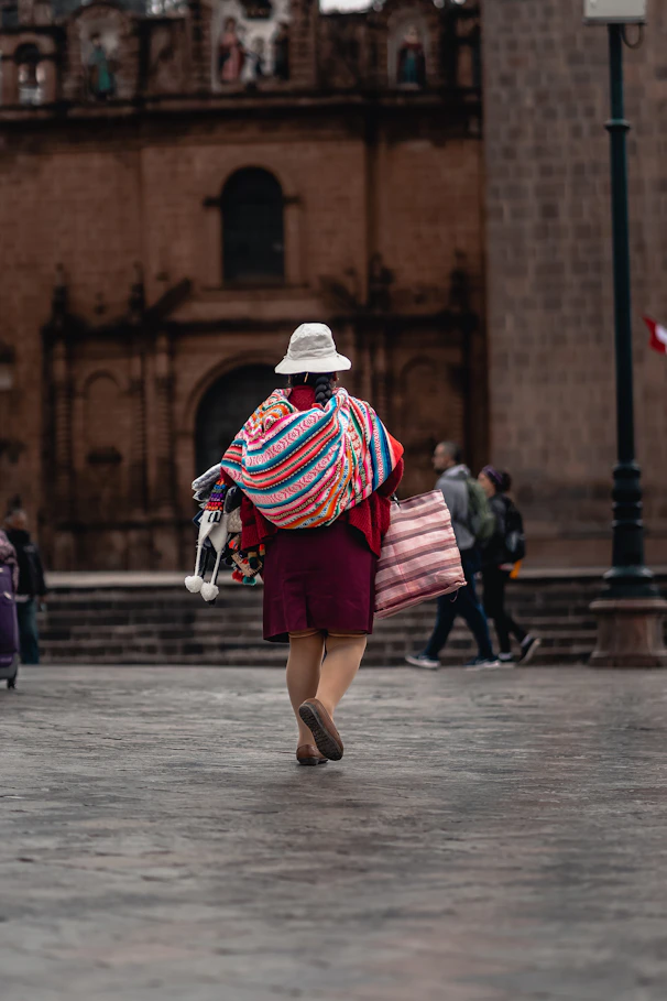 a person in a garment walking down a street