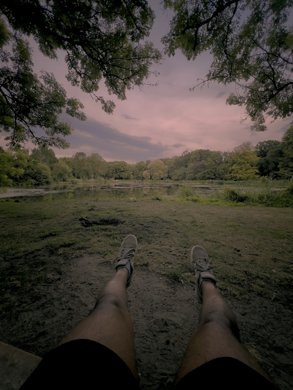 a pair of people's feet on a grass field