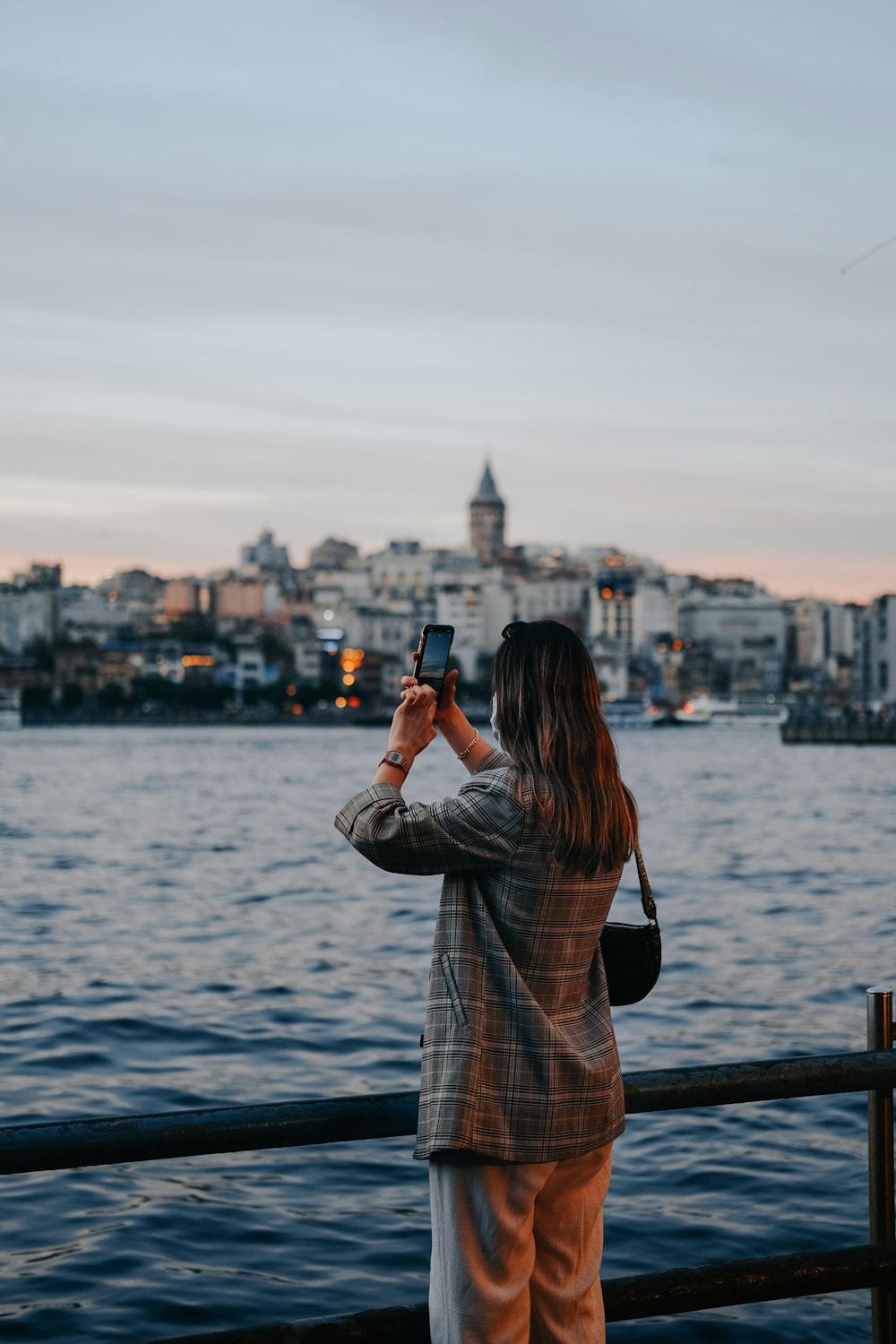 a person taking a picture of a city