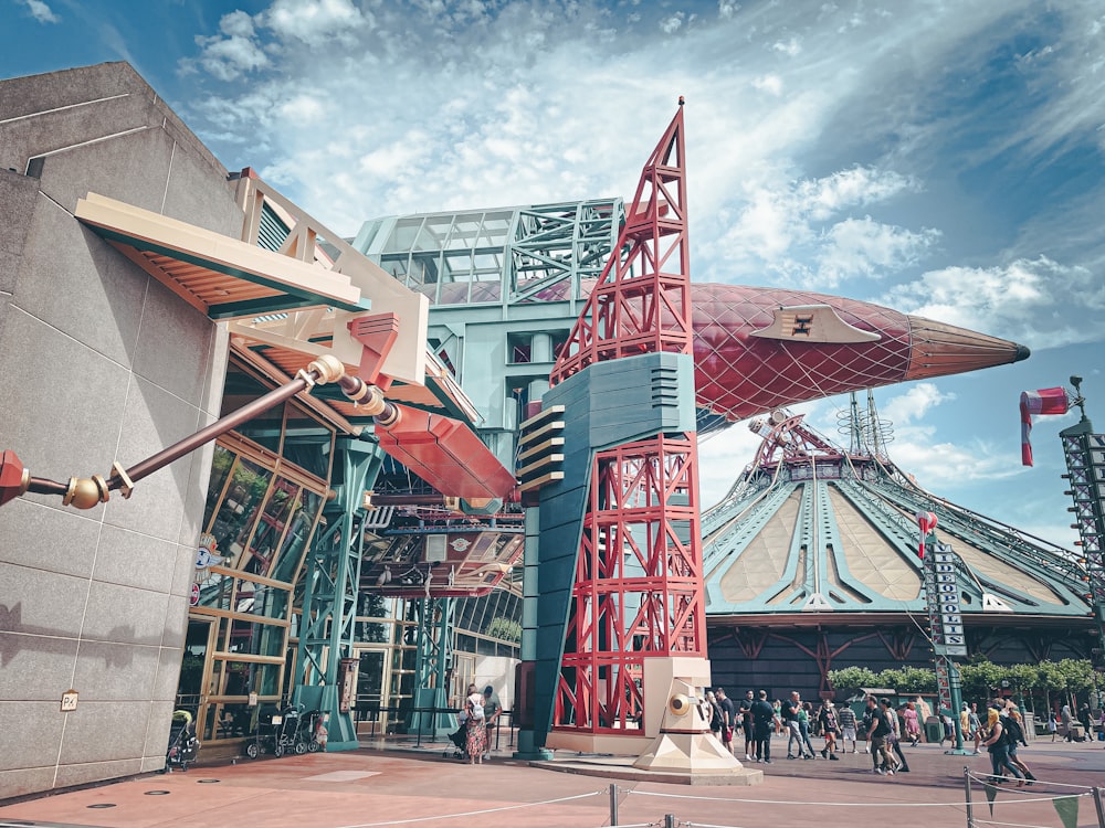 a roller coaster with people walking around