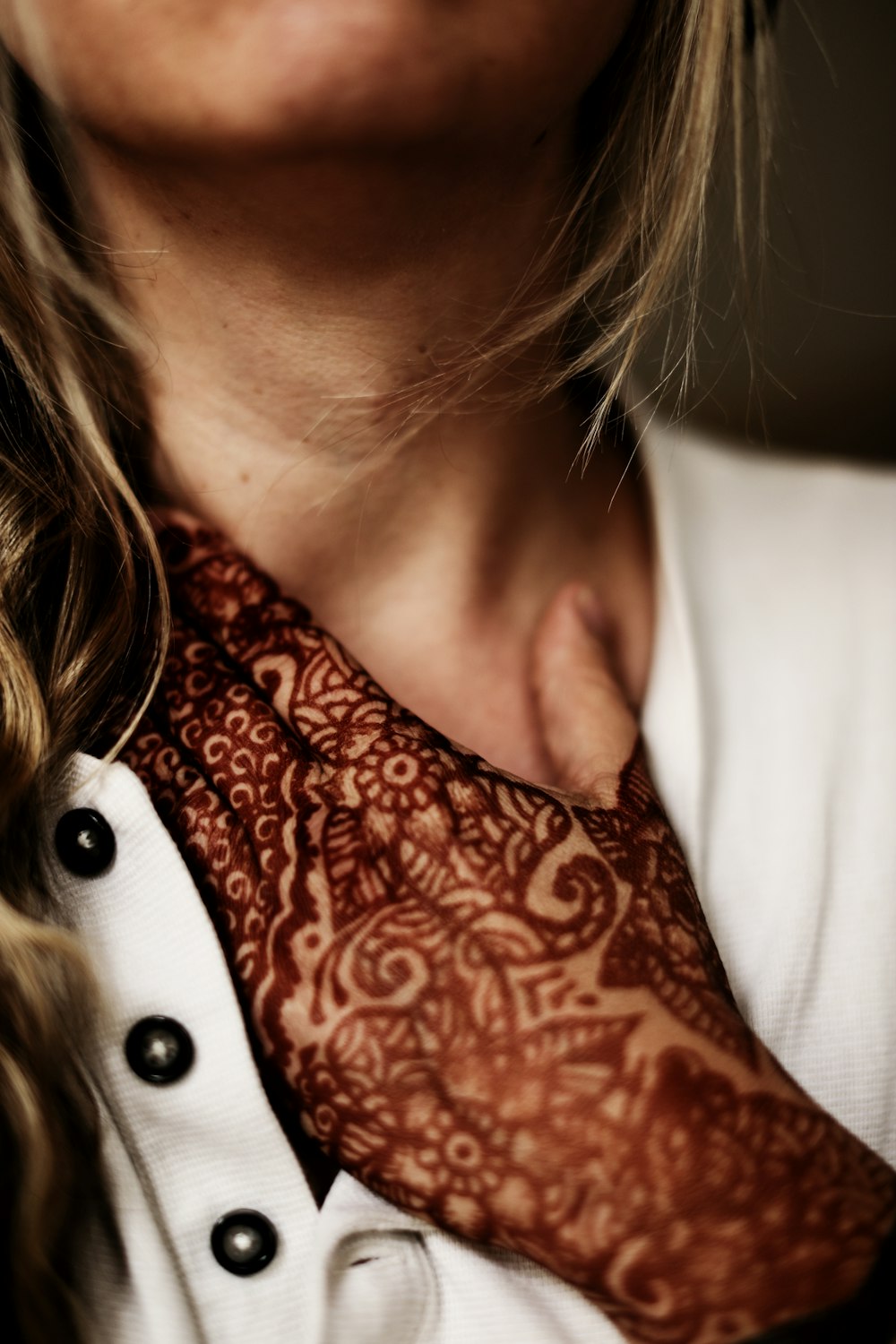 a person with a tattoo on the neck