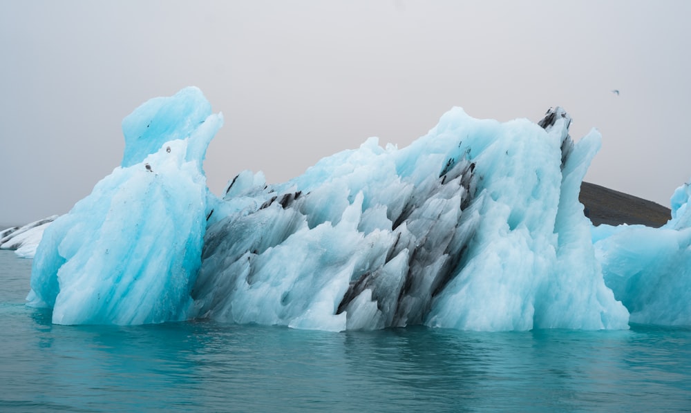 a group of icebergs in the water