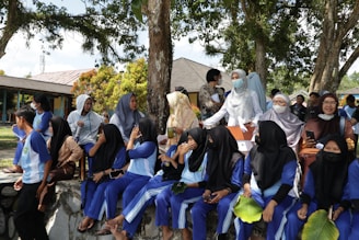 a group of people sitting on a bench