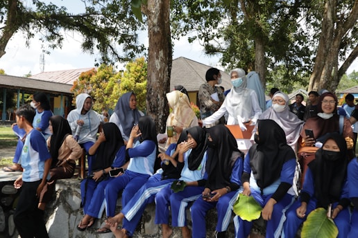 a group of people sitting on a bench