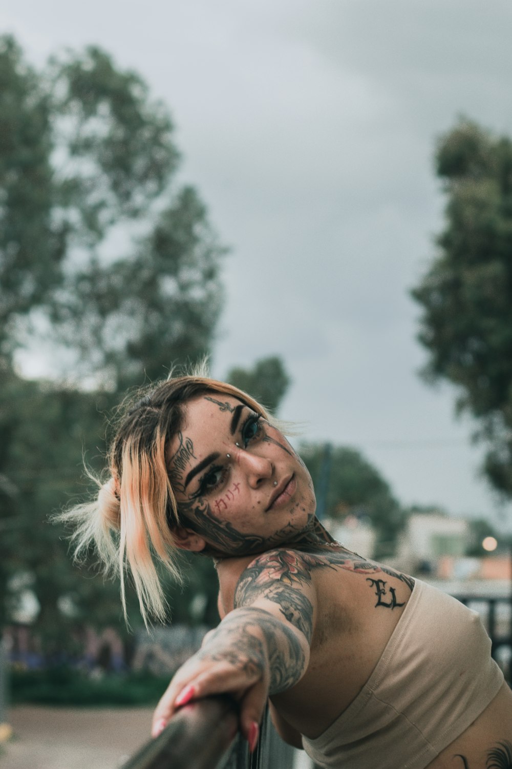 a man with tattoos smiling
