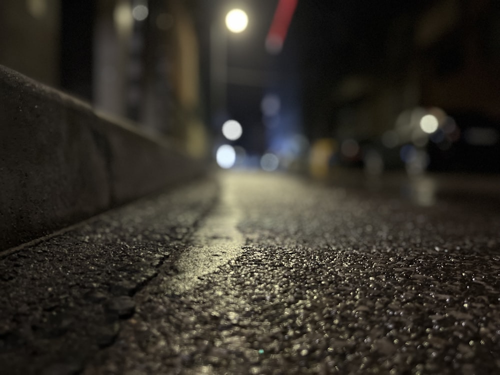 a blurry image of a street at night