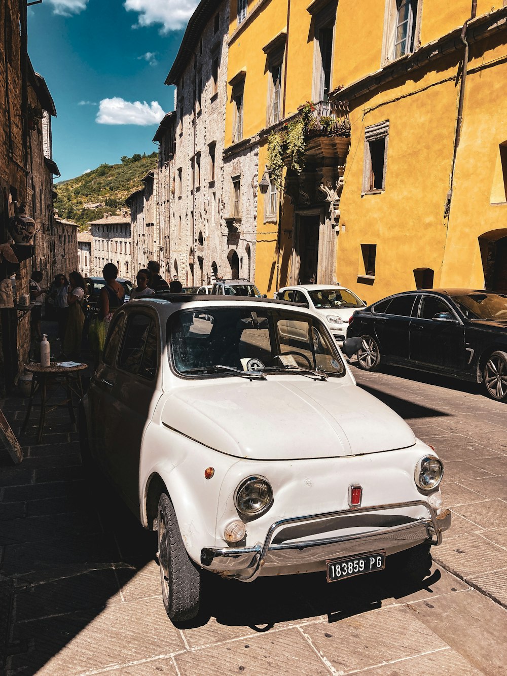 a white car parked on a street