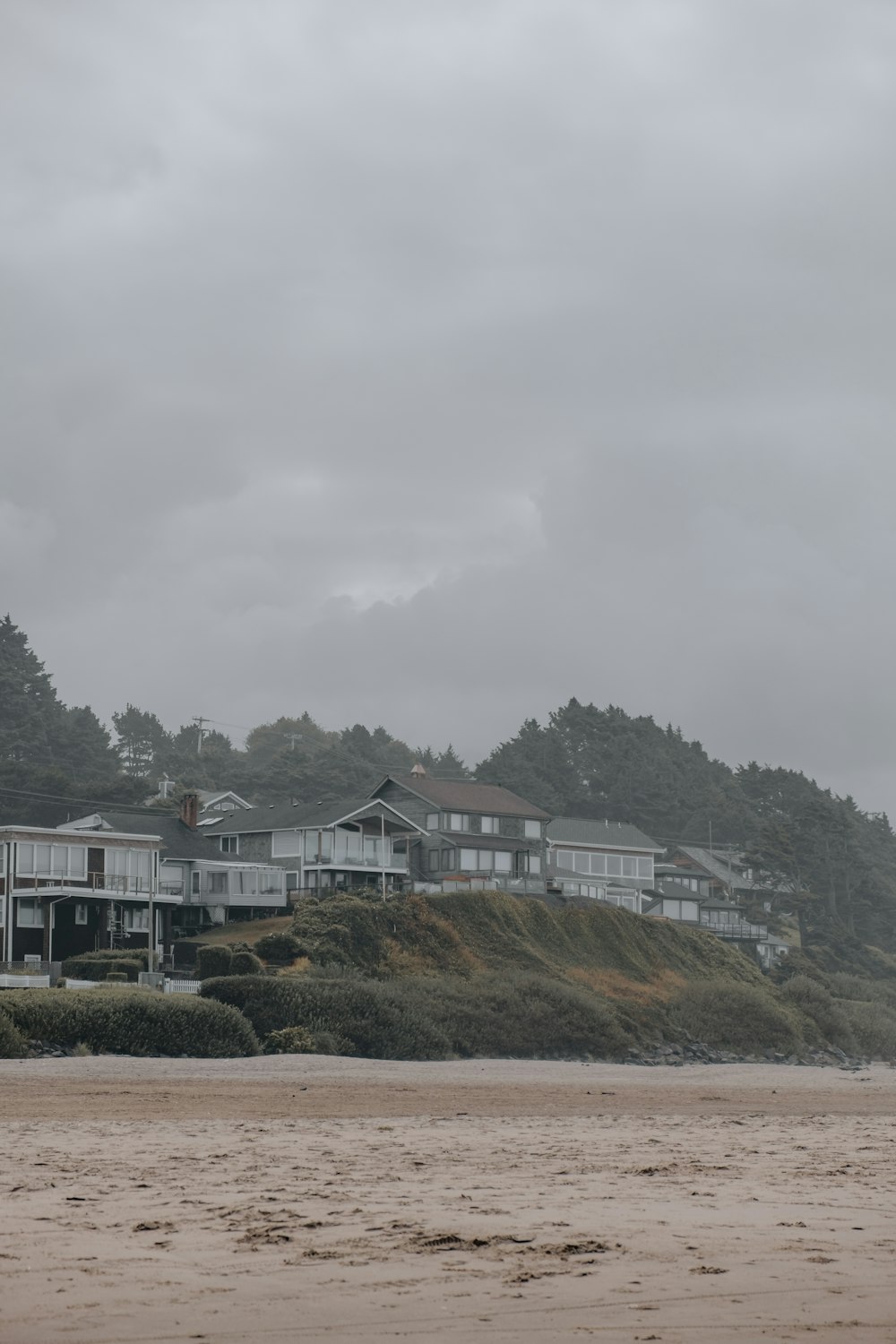 a group of houses on a beach